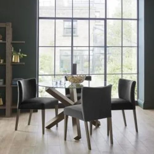 Bentley Designs Turin Glass 4 Seater Round Dining Table Dark Oak Legs with 4 Low Back Chairs in Gun Metal Velvet