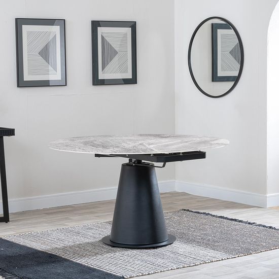 Carrara 4-6 Seater Grey Ceramic Round Swivel Motion Extending Dining Table with Black Pedestal Base - 135cm