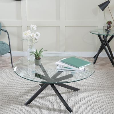 Product photograph of Chopstick Clear Glass Round Coffee Table With Black Metal Chopstick Legs from Choice Furniture Superstore