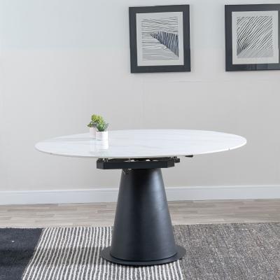 Product photograph of Carrara 135cm White Ceramic Round Dining Table With Black Pedestal Base from Choice Furniture Superstore