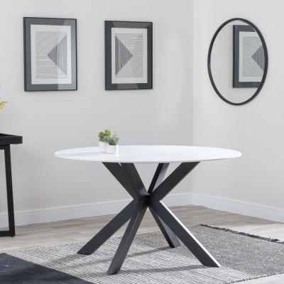 Product photograph of Novara 130cm White Ceramic Round Dining Table With Black Star Base from Choice Furniture Superstore