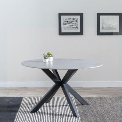 Product photograph of Novara 130cm Grey Ceramic Round Dining Table With Black Star Base from Choice Furniture Superstore