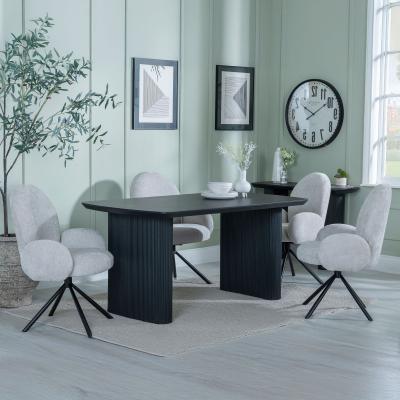 Product photograph of Bern Fluted Black Dining Set - Theo Grey Fabric Swivel Dining Chair from Choice Furniture Superstore