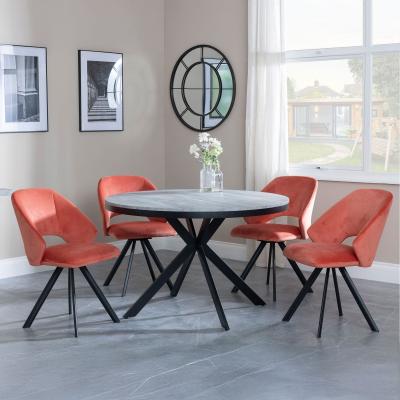 Bronx Grey Concrete Effect 4 Seater Round Dining Set With Spider Legs 4 Ion Orange Velvet Fabric Swivel Dining Chair