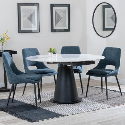 Carrara White Ceramic 4 Seater Round Extending Dining Set 4 Peyton Blue Fabric Dining Chair