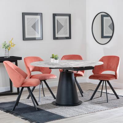 Carrara Grey Ceramic 4 Seater Round Extending Dining Set 4 Ion Orange Velvet Fabric Swivel Dining Chair