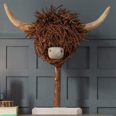 Product photograph of Voyage Maison Brown Wood Highland Cow Hand Crafted Sculpture from Choice Furniture Superstore