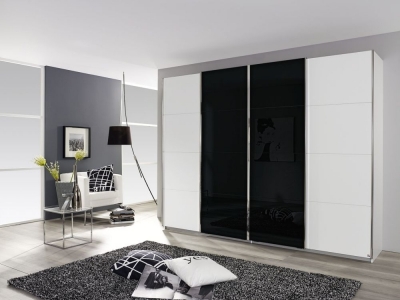 Product photograph of Rauch Syncrono 316cm White And Black Glass 4 Door Sliding Wardrobe from Choice Furniture Superstore