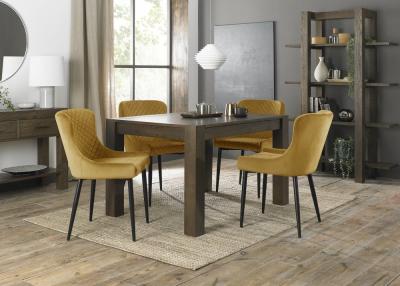 Product photograph of Bentley Designs Turin Dark Oak 4-6 Seater Extending Dining Table With 4 Cezanne Mustard Velvet Chairs - Black Legs from Choice Furniture Superstore