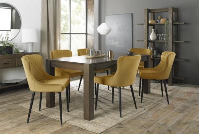 Product photograph of Bentley Designs Turin Dark Oak 6-10 Seater Extending Dining Table With 8 Cezanne Mustard Velvet Chairs - Black Legs from Choice Furniture Superstore