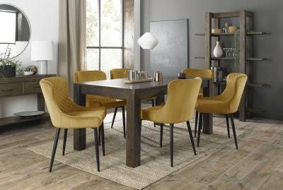Product photograph of Bentley Designs Turin Dark Oak 6-8 Seater Extending Dining Table With 6 Cezanne Mustard Velvet Chairs - Black Legs from Choice Furniture Superstore