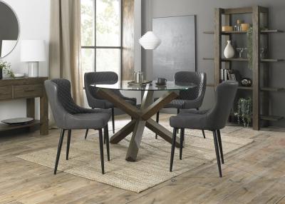 Bentley Designs Turin Glass 4 Seater Round Dining Table Dark Oak Legs With 4 Cezanne Dark Grey Faux Leather Chairs Black Legs