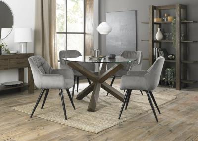 Bentley Designs Turin Glass 4 Seater Round Dining Table Dark Oak Legs With 4 Dali Grey Velvet Chairs