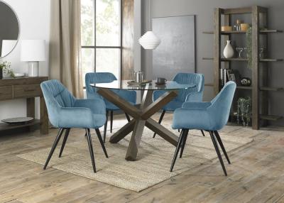Bentley Designs Turin Glass 4 Seater Round Dining Table Dark Oak Legs With 4 Dali Petrol Blue Velvet Chairs
