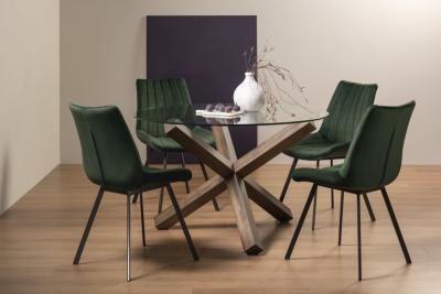 Bentley Designs Turin Glass 4 Seater Round Dining Table Dark Oak Legs With 4 Fontana Green Velvet Chairs