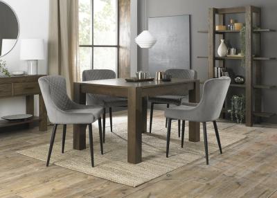 Product photograph of Bentley Designs Turin Dark Oak 4-6 Seater Extending Dining Table With 4 Cezanne Grey Velvet Chairs - Black Legs from Choice Furniture Superstore