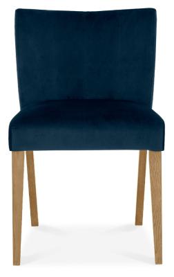 Product photograph of Bentley Designs Turin Light Oak Low Back Dark Blue Velvet Fabric Dining Chair Sold In Pairs from Choice Furniture Superstore