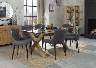 Product photograph of Bentley Designs Turin Glass 6 Seater Dining Table Light Oak Legs With 6 Cezanne Dark Grey Faux Leather Chairs - Black Legs from Choice Furniture Superstore