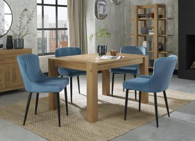 Product photograph of Bentley Designs Turin Light Oak 4-6 Seater Extending Dining Table With 4 Cezanne Petrol Blue Velvet Chairs - Black Legs from Choice Furniture Superstore