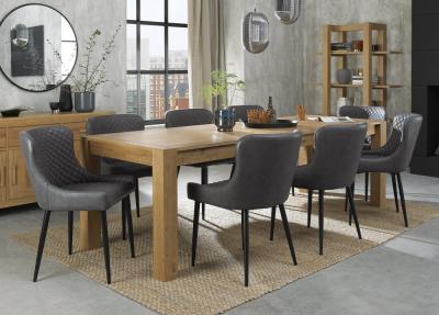 Bentley Designs Turin Light Oak 610 Seater Extending Dining Table With 8 Cezanne Dark Grey Faux Leather Chairs Black Legs