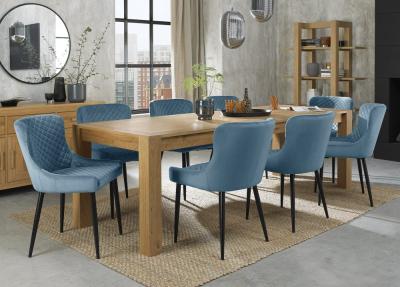 Product photograph of Bentley Designs Turin Light Oak 6-10 Seater Extending Dining Table With 8 Cezanne Petrol Blue Velvet Chairs - Black Legs from Choice Furniture Superstore