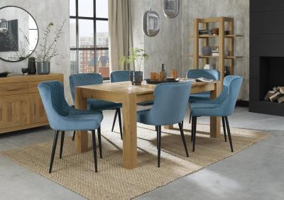 Product photograph of Bentley Designs Turin Light Oak 6-8 Seater Extending Dining Table With 6 Cezanne Petrol Blue Velvet Chairs - Black Legs from Choice Furniture Superstore