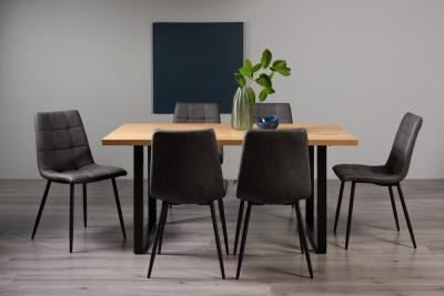 Product photograph of Bentley Designs Ramsay Oak Melamine 6 Seater Dining Table - U Leg With 6 Mondrian Dark Grey Faux Leather Chairs from Choice Furniture Superstore