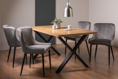 Product photograph of Bentley Designs Ramsay Oak Melamine 6 Seater Dining Table - X Leg With 4 Cezanne Grey Velvet Chairs - Black Legs from Choice Furniture Superstore
