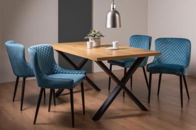 Product photograph of Bentley Designs Ramsay Oak Melamine 6 Seater Dining Table - X Leg With 4 Cezanne Petrol Blue Velvet Chairs - Black Legs from Choice Furniture Superstore