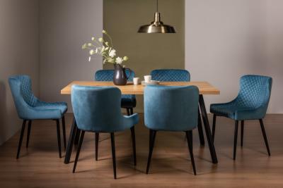 Product photograph of Bentley Designs Ramsay Oak Melamine 6 Seater Dining Table With 6 Cezanne Petrol Blue Velvet Chairs - Black Legs from Choice Furniture Superstore