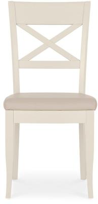 Product photograph of Bentley Designs Montreux Antique White And Ivory Bonded Leather Dining Chair - Sold In Pairs from Choice Furniture Superstore