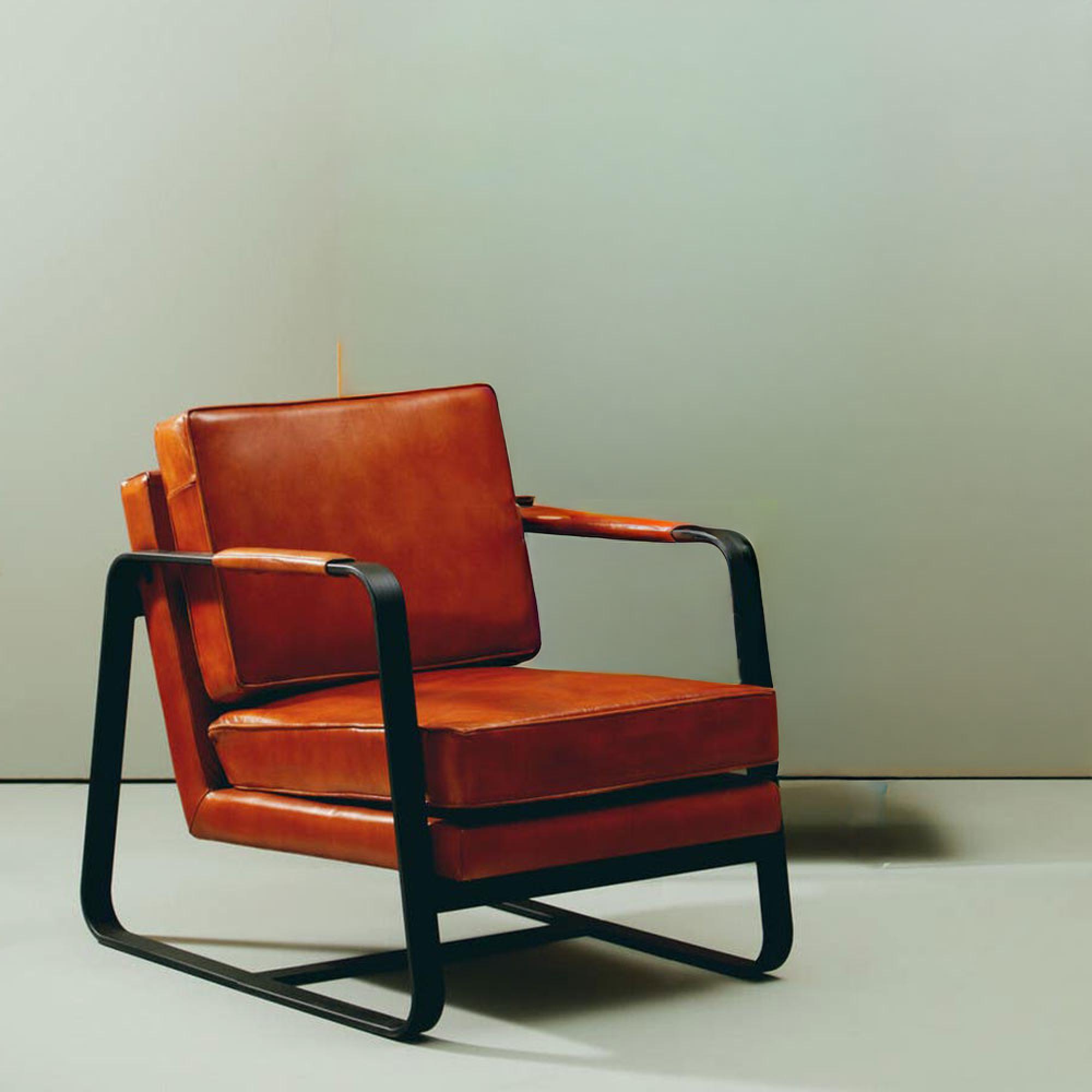 Buffalo Tan Leather and Black Metal Armchair