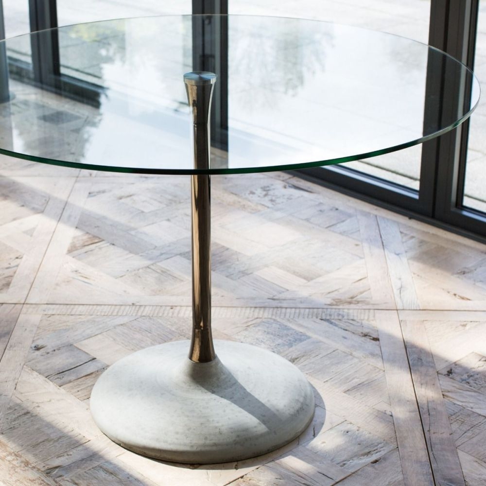 Product photograph of Swan Clear Glass And Brass Column 2 Seater Round Dining Table With Concrete Base from Choice Furniture Superstore.