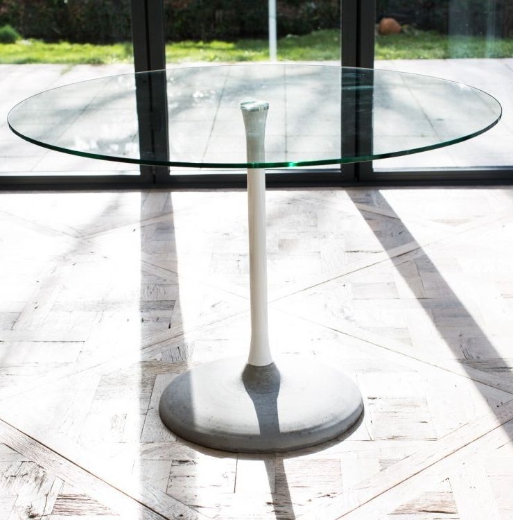 Product photograph of Gillmore Space Swan Clear Glass Top And Dark Chrome Column 80cm Round Dining Table With Concrete Base from Choice Furniture Superstore.