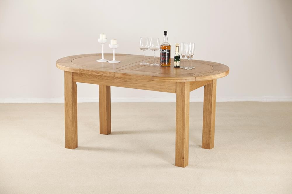 Product photograph of Kent Oak Oval Extending Dining Table from Choice Furniture Superstore.