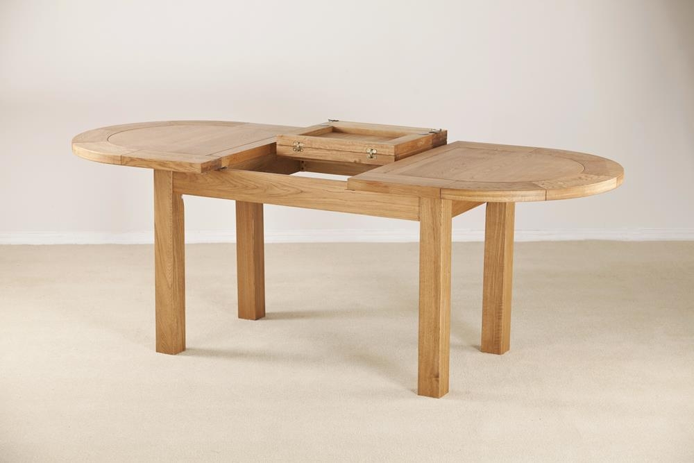 Product photograph of Kent Oak Oval Extending Dining Table from Choice Furniture Superstore.