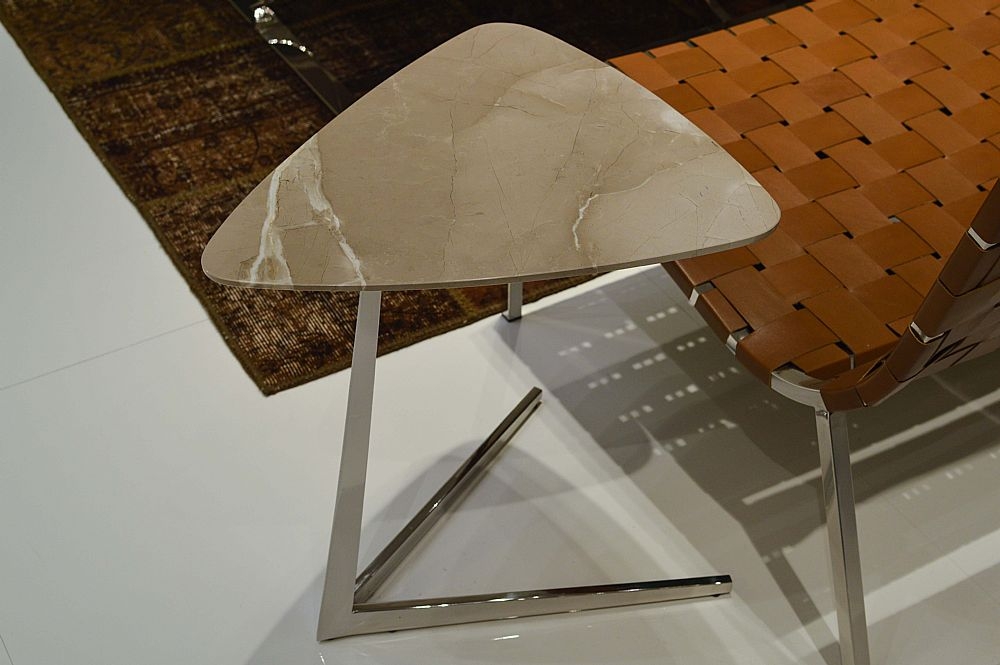 Product photograph of Stone International Plectrum Triangular Accent Table - Marble And Polished Steel from Choice Furniture Superstore.
