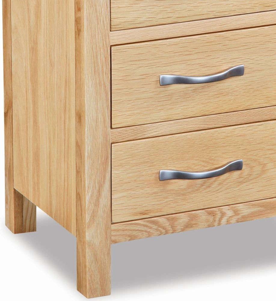 Product photograph of New Trinity Natural Oak 3 Drawer Bedside Cabinet from Choice Furniture Superstore.