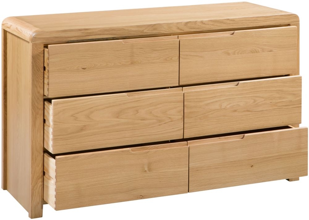 Product photograph of Curve Oak 6 Drawer Wide Chest from Choice Furniture Superstore.
