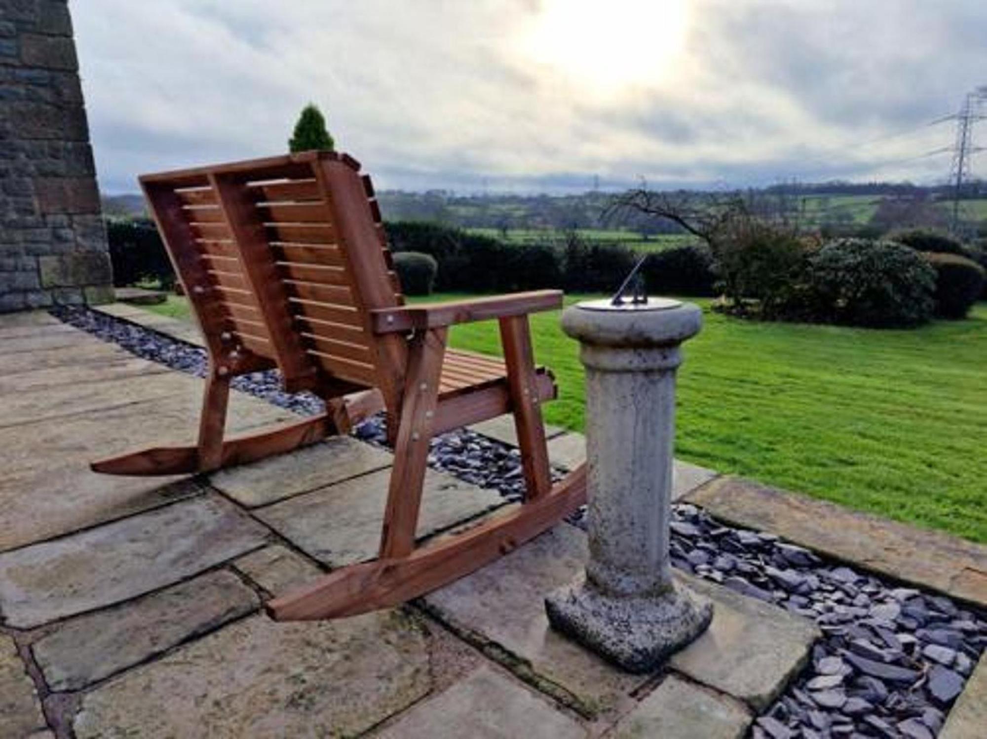 Product photograph of Churnet Valley Brown Outdoor Rocking Bench from Choice Furniture Superstore.