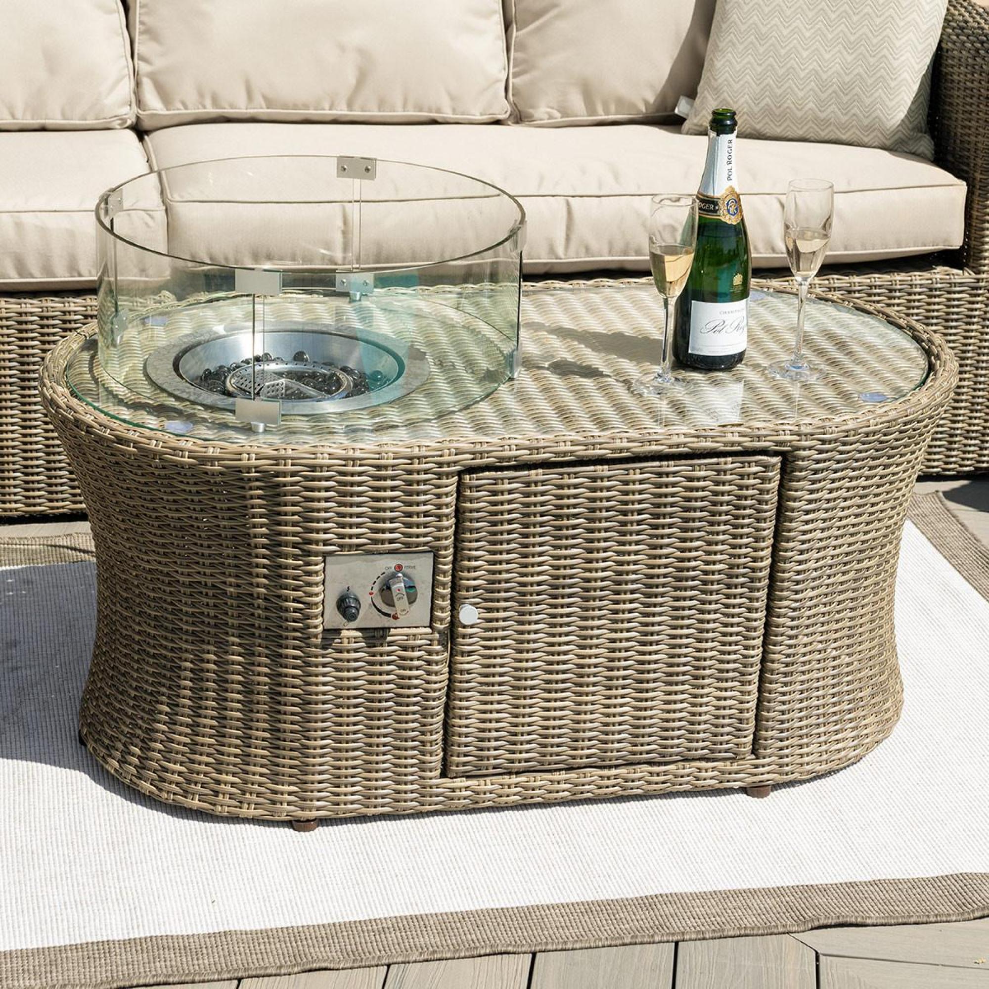 Product photograph of Maze Winchester Natural Rattan Oval Fire Pit Coffee Table from Choice Furniture Superstore.