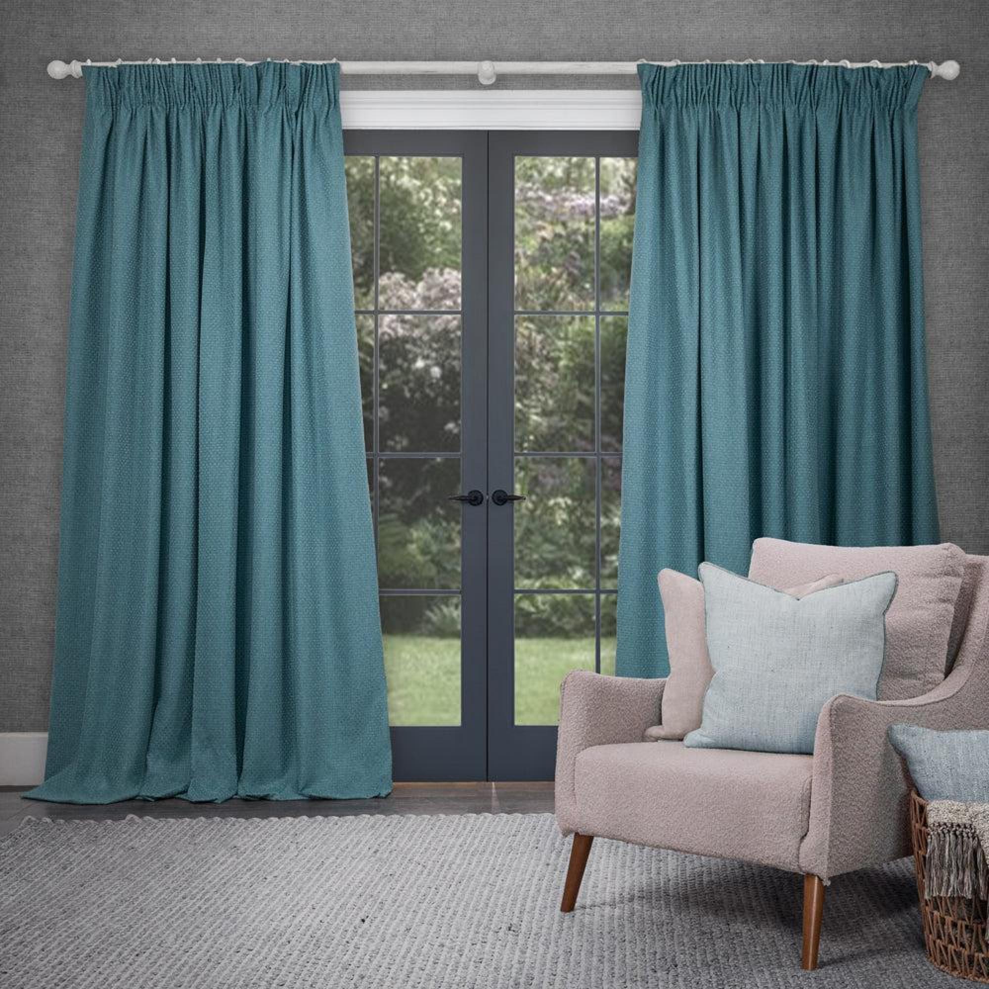 Product photograph of Voyage Maison Nessa Teal Woven Pencil Pleat Curtains from Choice Furniture Superstore.