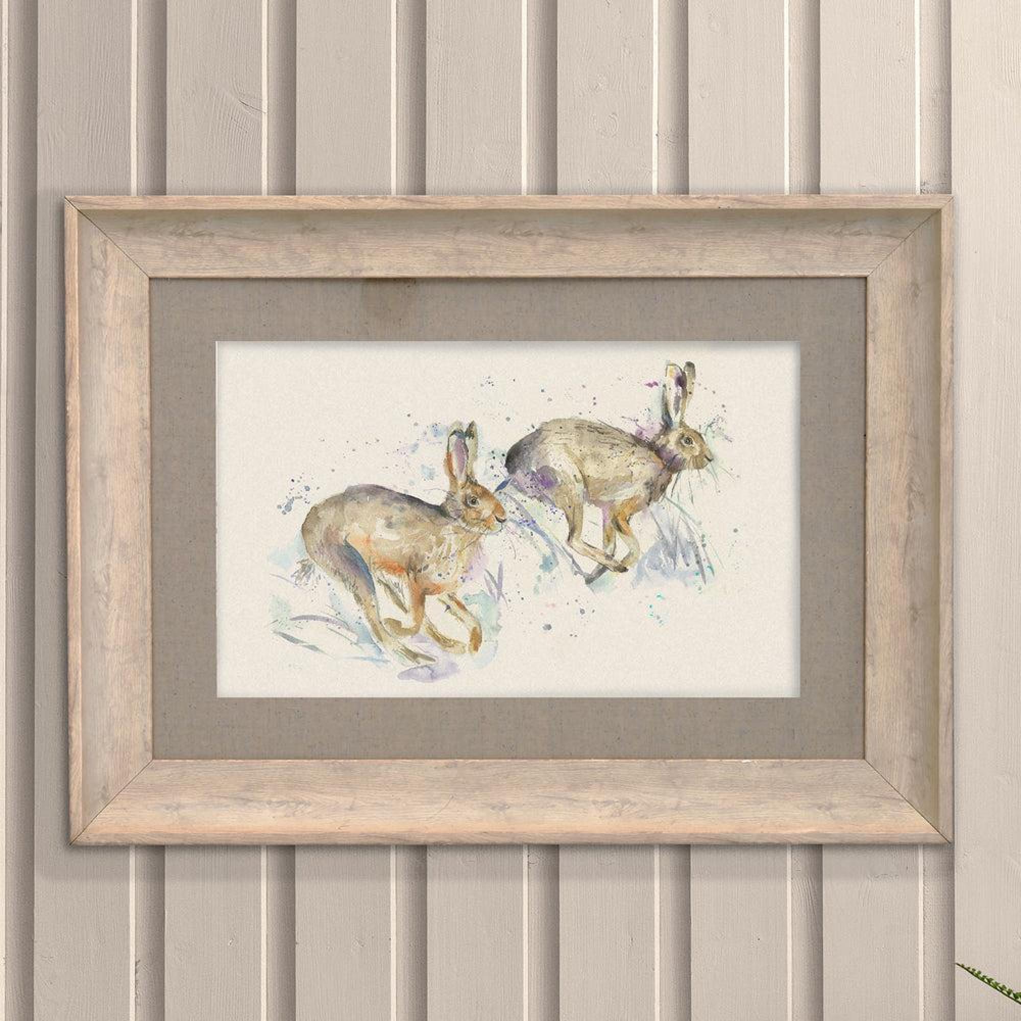 Product photograph of Voyage Maison Hurtling Hares Birch Framed Print from Choice Furniture Superstore.