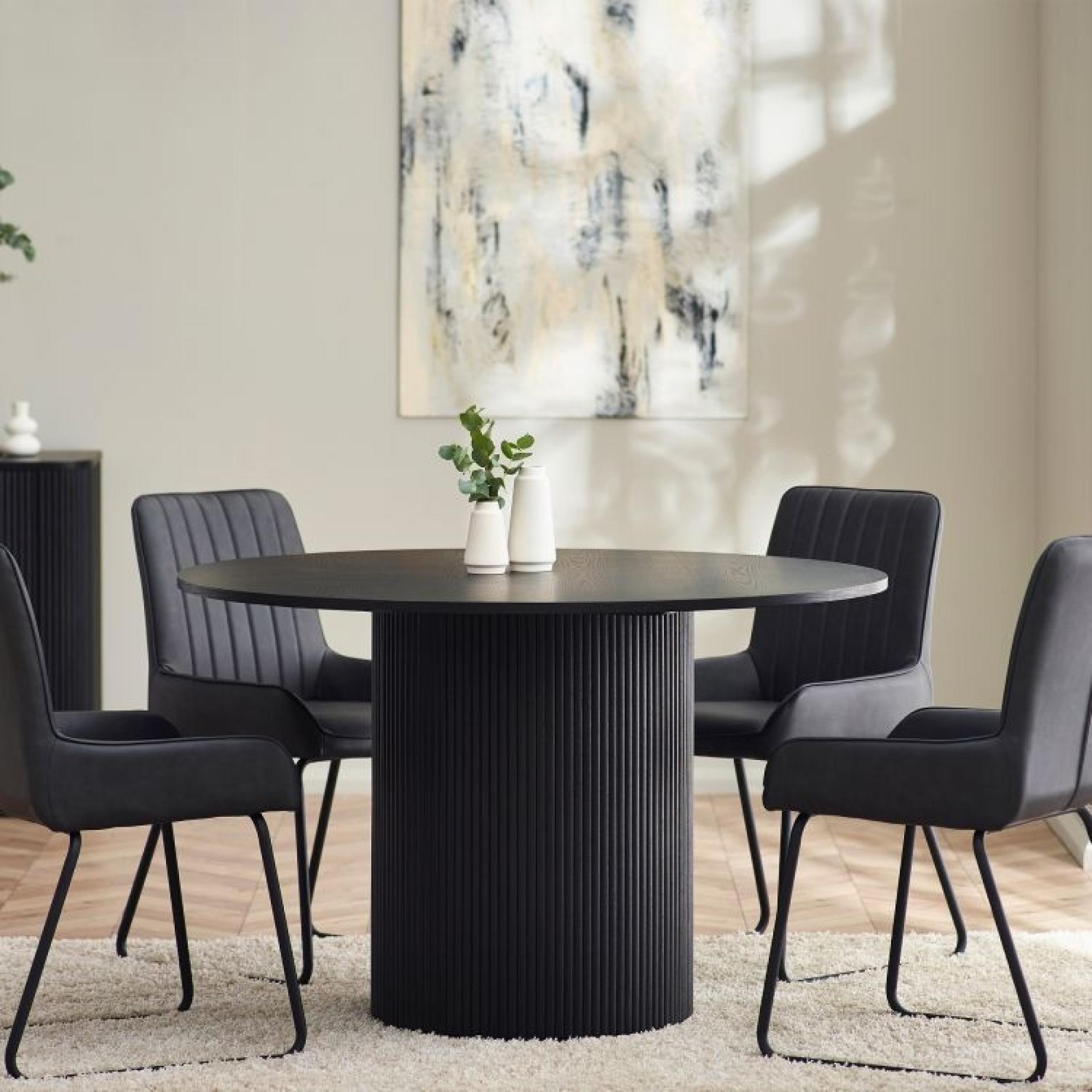 Product photograph of Louis Black Fluted 4 Seater Round Dining Table from Choice Furniture Superstore.