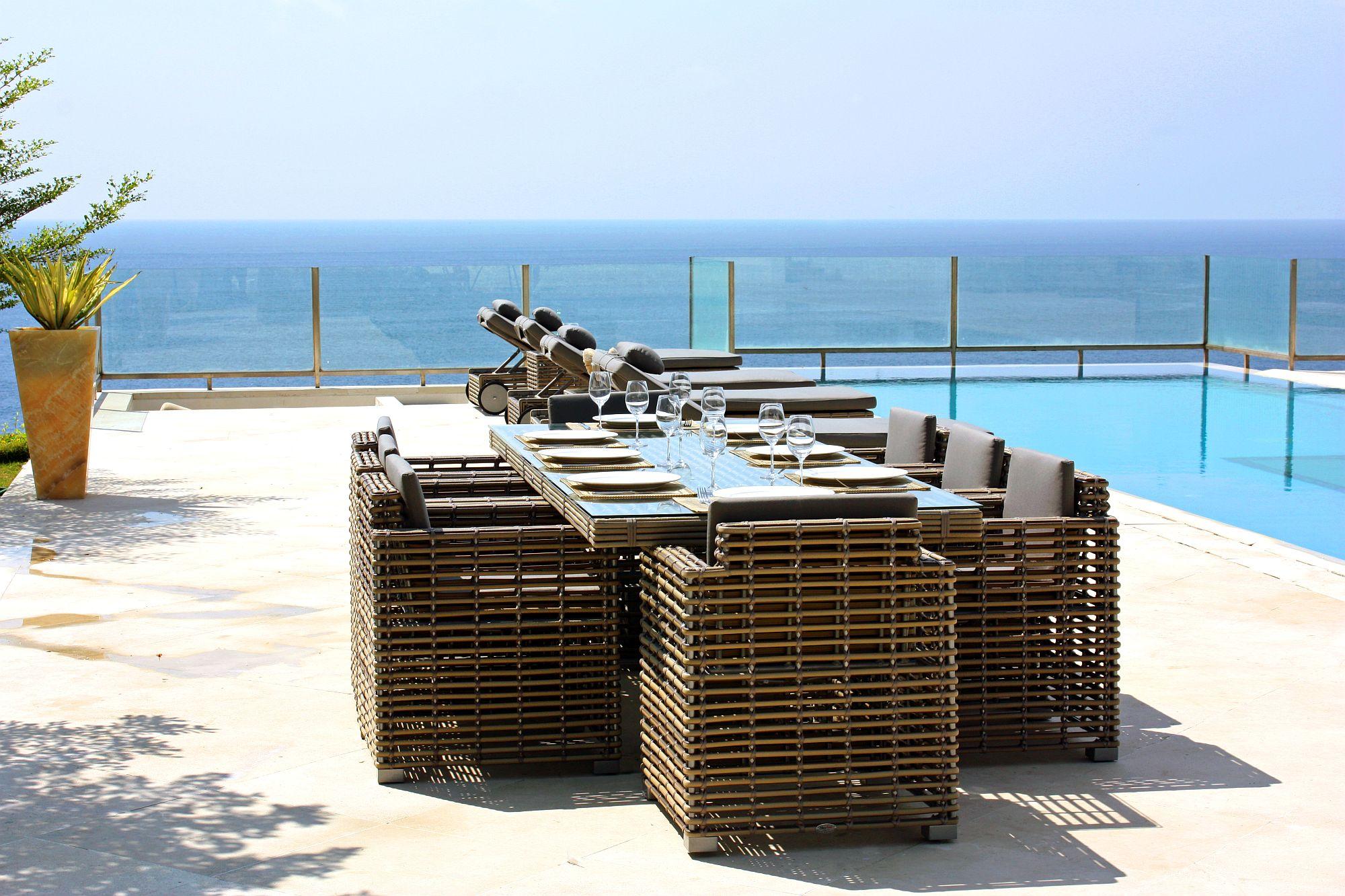 Product photograph of Skyline Castries Walnut Rattan And Glass Top Outdoor 12 Seater Dining Table - 280cm from Choice Furniture Superstore.