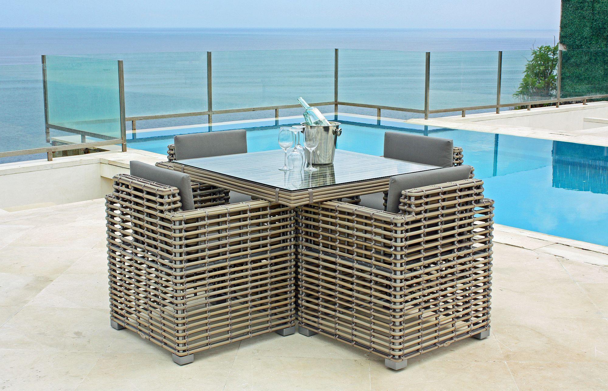 Product photograph of Skyline Castries Walnut Rattan Outdoor Dining Armchair from Choice Furniture Superstore.