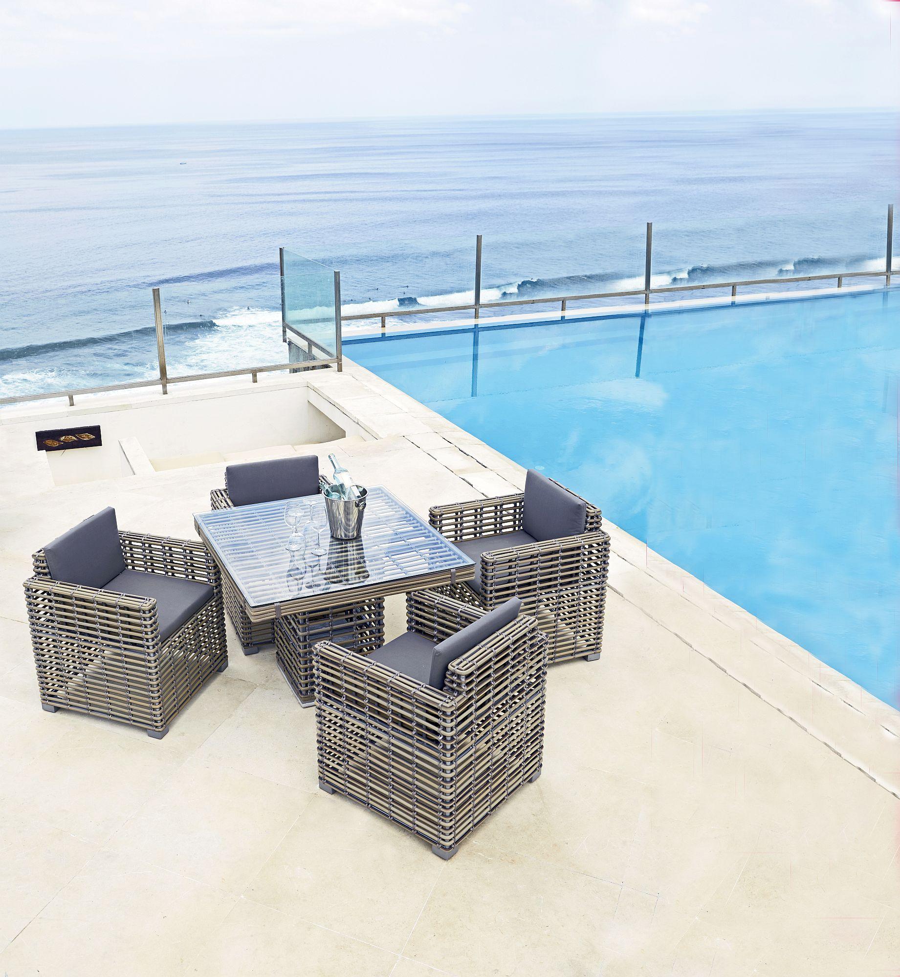 Product photograph of Skyline Castries Walnut Rattan Outdoor Dining Armchair from Choice Furniture Superstore.