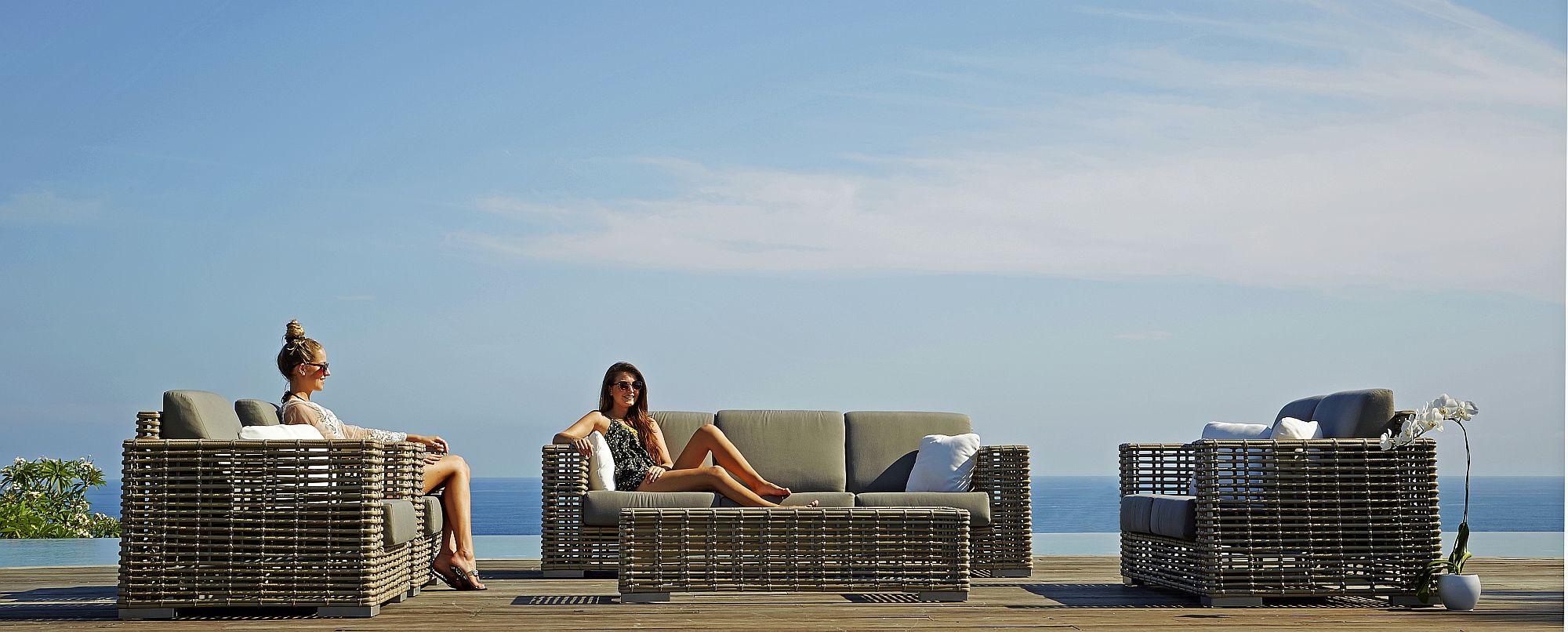 Product photograph of Skyline Castries Walnut Rattan Outdoor 3 Seater Sofa from Choice Furniture Superstore.