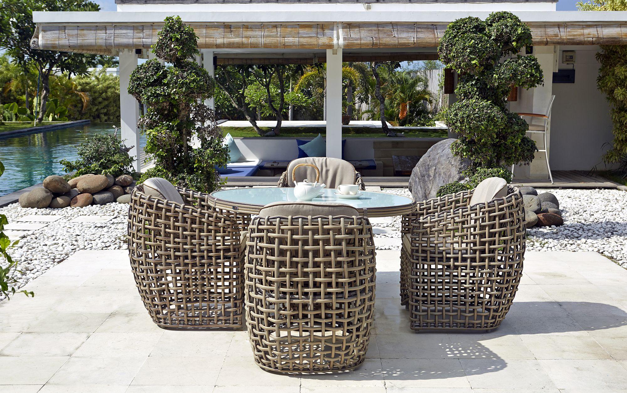 Product photograph of Skyline Dynasty Walnut Rattan And Glass Top Outdoor 4 Seater Round Dining Table - 120cm from Choice Furniture Superstore.