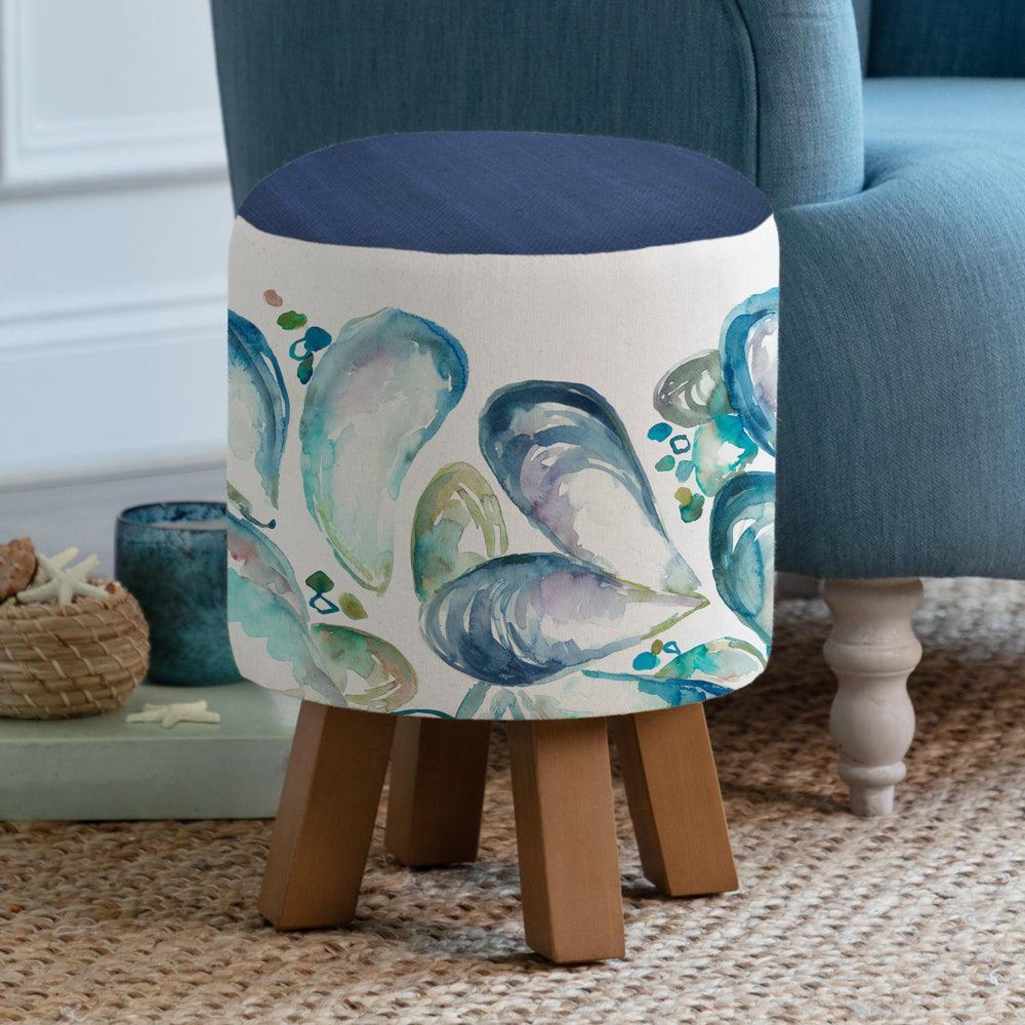 Product photograph of Voyage Maison Mussel Shells Marine Monty Round Footstool from Choice Furniture Superstore.